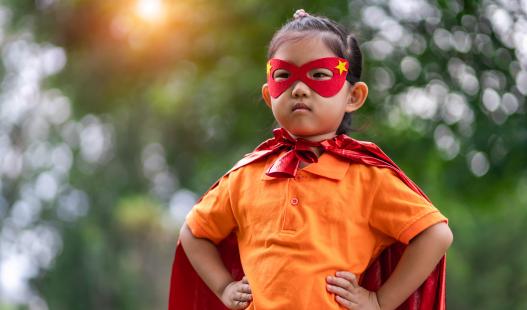child with a superhero costume
