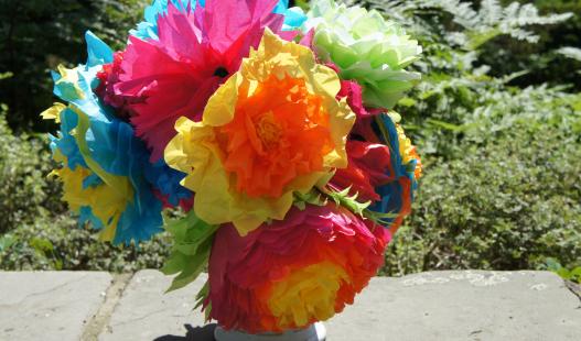 A bouquet of brightly colored tissue paper flowers