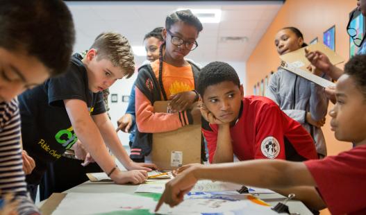 Group of students gathered around a table