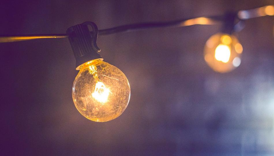 Closeup photo of a lightbulb on a string of lights