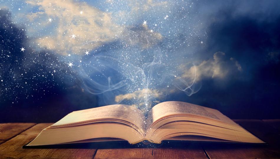 An old book lay open on a wooden table, set against a background of glittering stars
