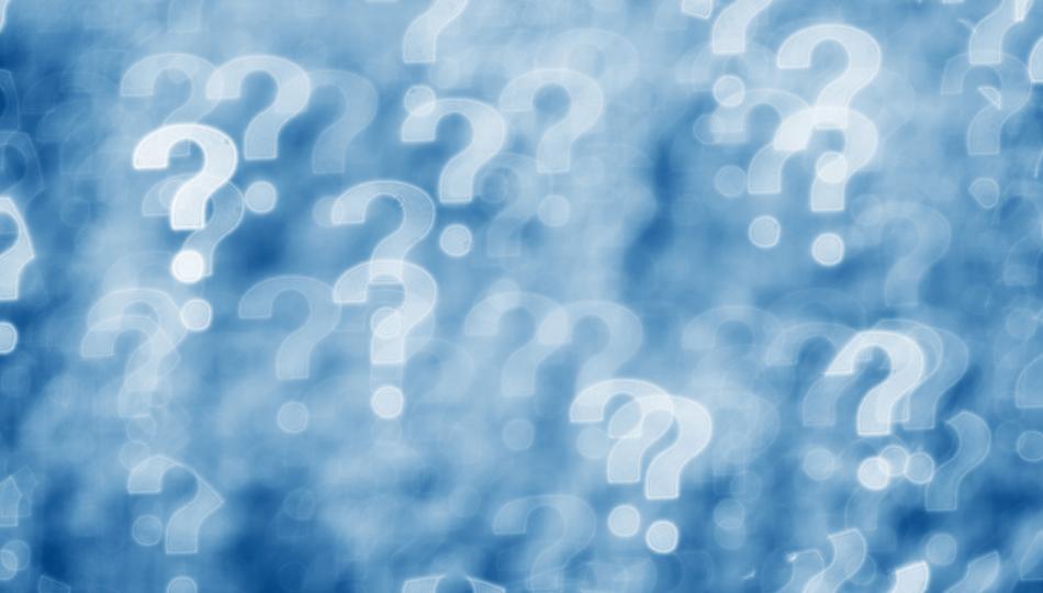 A blue and white collage of blurry question marks.