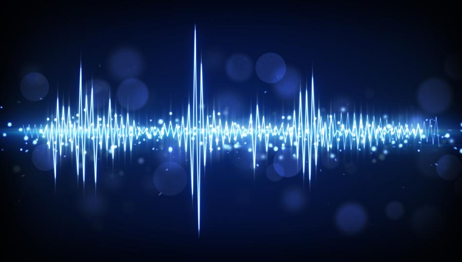 A blue audio waveform set against a dark background.