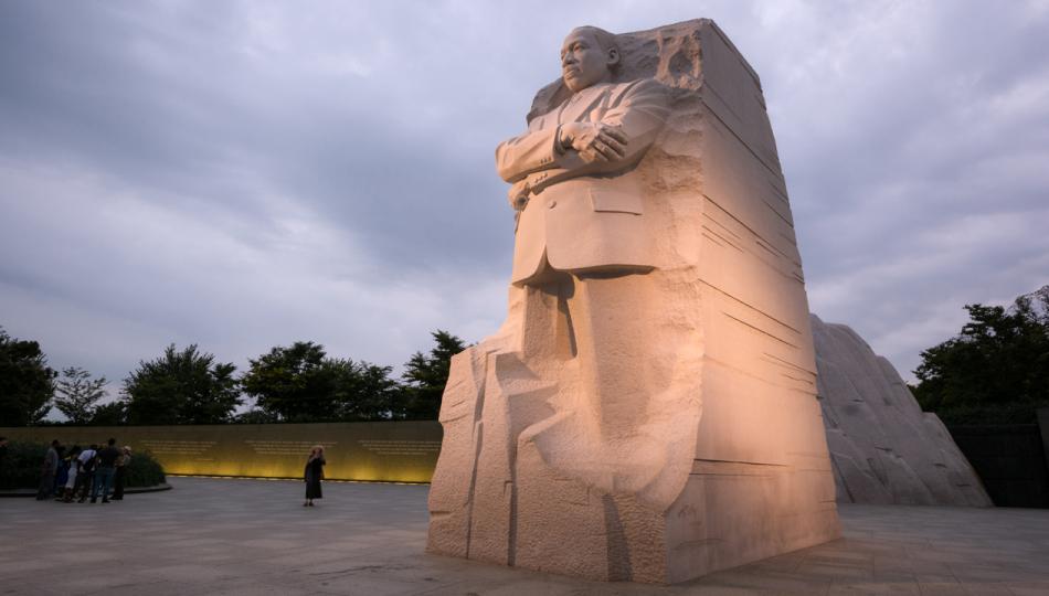 The Martin Luther King, Jr. memorial in Washington, D.C. on a cloudy day at dusk.