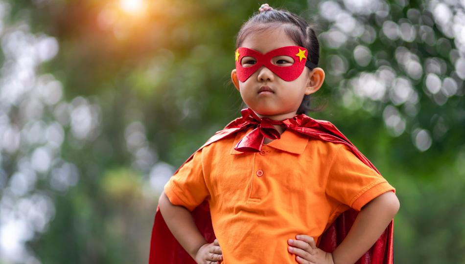 child with a superhero costume