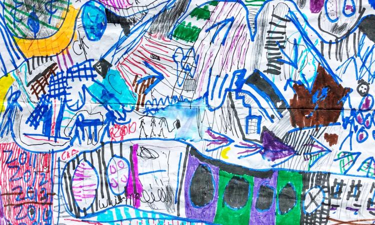 A child’s colorful drawing of an intricate map.