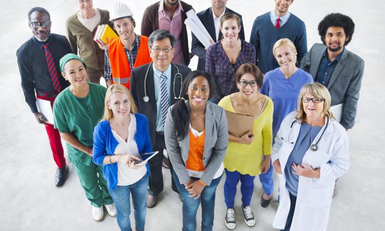 A group of people in various types of professional dress