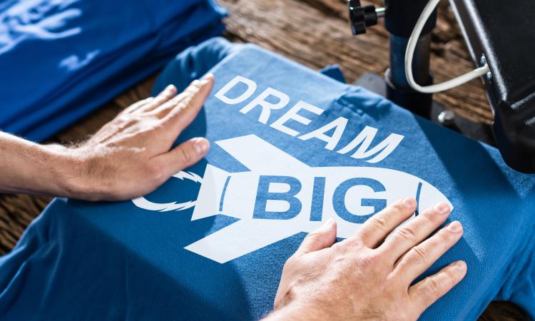 Blue t-shirt with the phrase "Dream Big"