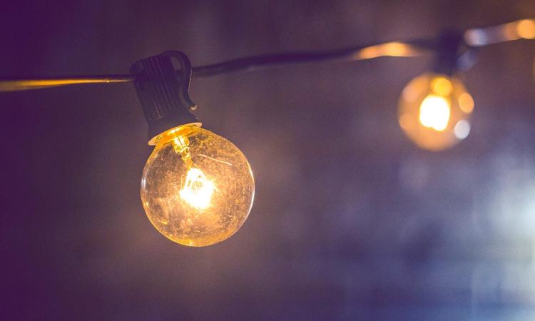 Closeup photo of a lightbulb on a string of lights